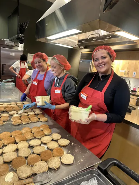 The kitchen crew preparing meals for the community